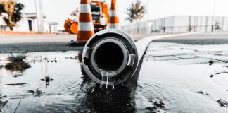 water coming out from gray pipe