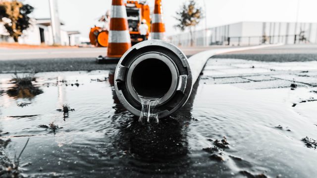 Photo by Daan Mooij water coming out from gray pipe