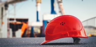 red hard hat on pavement