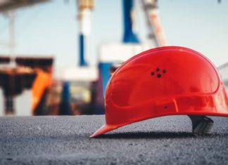 What is Construction Sequencing, and Why is it Important? red hard hat on pavement
