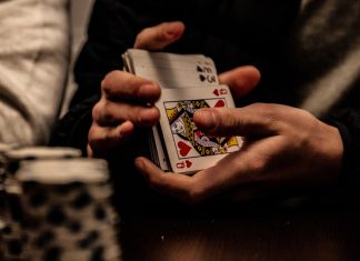 Famous People Who Have Participated in WSOP person holding king of spade playing card