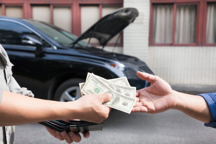giving and taking money for car service concept
