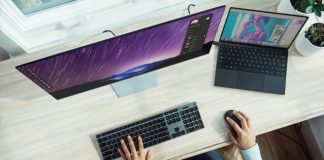 person using laptop on table