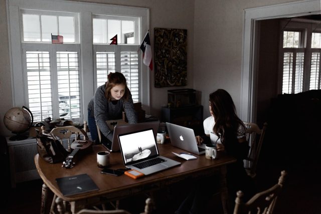 Photo by Andrew Neel women using laptop on brown wooden table