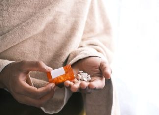 Experts Answer 5 Questions About Drug Abuse orange and white plastic bottle on white textile