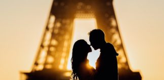 silhouette of man and woman kissing during sunset
