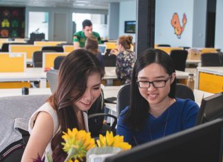 Top Benefits of Hiring an Employer of Record For Your Company selective focus photography of two women in front of computer monitor