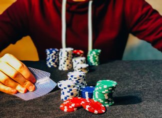New Trends in Online Casinos person sitting near poker chips
