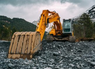 Trends in the Earthmoving Equipment Sector yellow and black excavator on rocky ground