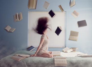 The History of Aptitude Tests   woman sitting on bed with flying books