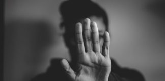 close-up photography of person lifting hands