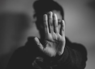 5 Reasons For Hiring Lawyers When You Face Domestic Violence  close-up photography of person lifting hands