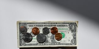 silver and gold round coins in box