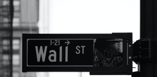 grayscale photo of Wall St. signage