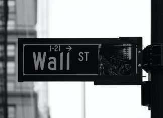 Bull and Bear markets explained grayscale photo of Wall St. signage
