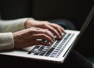How to Write a Thesis Without Plagiarism? person using laptop