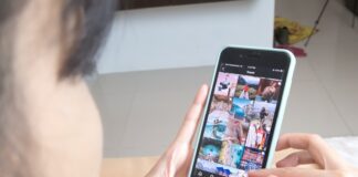 person holding silver iphone 6