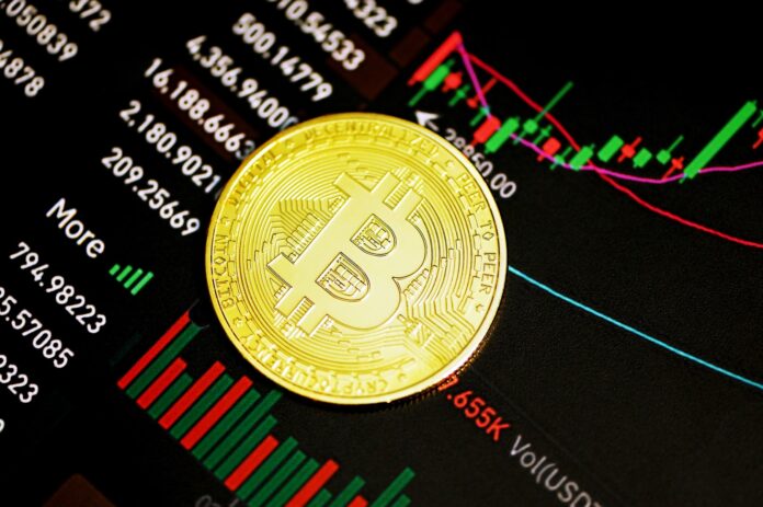 Photo by Kanchanara gold round coin on black surface