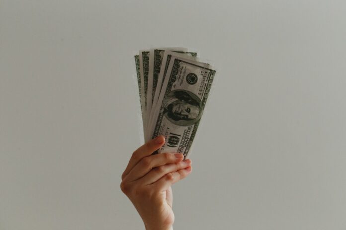 Photo by Jp Valery 100 US dollar banknote