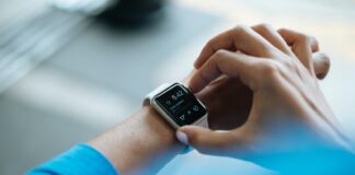 person clicking Apple Watch smartwatch