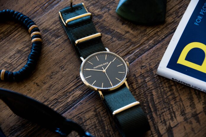Photo by Hunters Race round silver-colored analog watch with black strap
