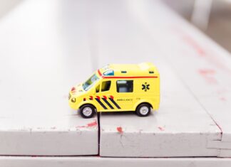 The impact of bitcoin on hospitals yellow car toy on white surface