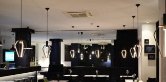 grey and brown wooden tables inside room