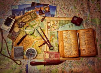 Why Outdoor Scavenger Hunt App Is the Perfect Virtual Team Building Activity To Do This Fall in 2022  brown wooden scissors on brown and white book