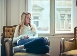 Winter Entertainment Options for 2022 woman sitting on brown armchair