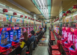 Pros and Cons of Pay N Play Casino people sitting on red plastic chairs inside building