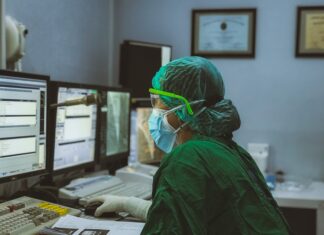 FHIR vs. HL7: A Detailed Comparison person in green shirt wearing white mask