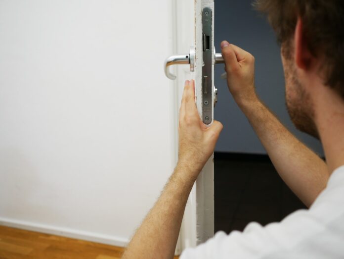 Photo by Maria Ziegler person holds door lever