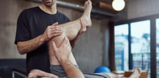 A person lifting another person Description automatically generated with low confidence