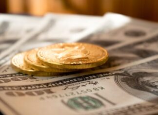 Perks of Using Bitcoin in Daily Life three round gold-colored coins on 100 US dollar banknotes