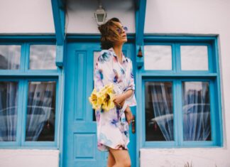 4 Basic Rules for Wearing a Kimono woman in white and blue floral dress holding yellow flower bouquet standing beside blue wooden window
