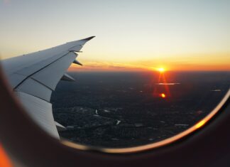airplanes window view of sky during golden hour
