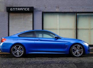 When Should You File A Claim For Reduced Compensation? blue coupe beside gray house