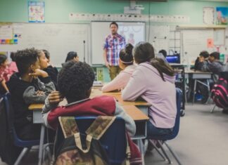 Four of the Best Teaching Positions to Get in 2023 man and woman sitting on chairs