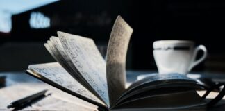 open book on brown wooden table