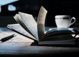 Malthus – An Essay on the Principle of Population open book on brown wooden table