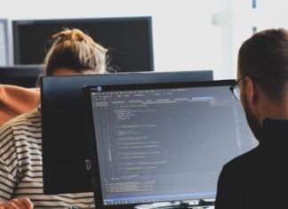 Information Required for Cisco Network Certification woman in black shirt sitting beside black flat screen computer monitor