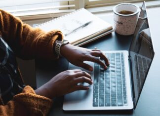Management Pioneers Essays person using black and silver laptop computer