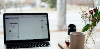 MacBook Pro near white open book