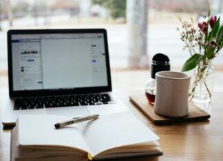 Why Tech Has Allowed Students to Thrive MacBook Pro near white open book