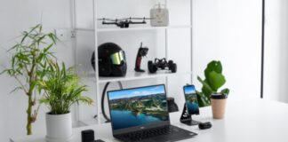 black laptop computer on white table