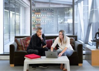 All You Need to Know About Registered Agents – The Pros and the Cons man and woman sitting on couch using macbook