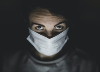 Is Humanity Prepared for Another Pandemic? man in black crew neck shirt