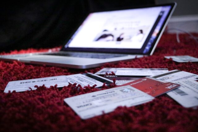 Photo by Dylan Gillis white printer paper on red textile