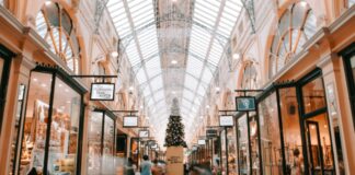 person walking inside building near glass