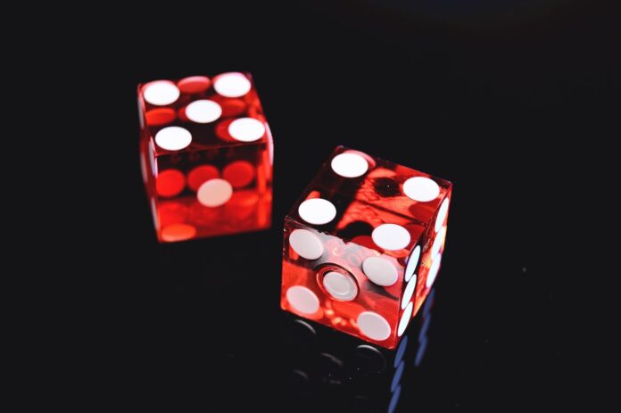 Photo by Jonathan Petersson two red-and-white dices
